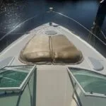 Front view of a private boat, with the camera facing out toward the open sea.