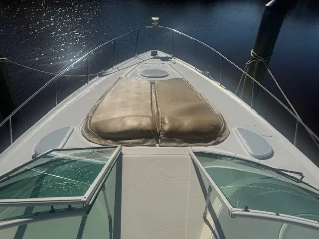 Front view of a private boat, with the camera facing out toward the open sea.