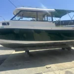 Trophy 2359 Walkaround underway with hardtop cabin and Green gelcoat, built for Chesapeake Bay fishing.